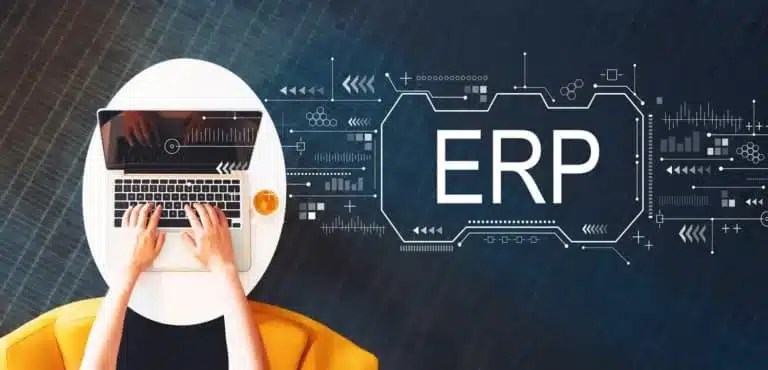 Small business owner reviewing ERP software dashboard