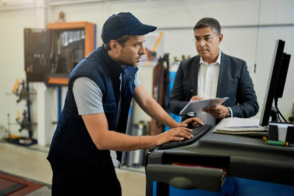 CompuCash Dubai install team setting up a POS on-site